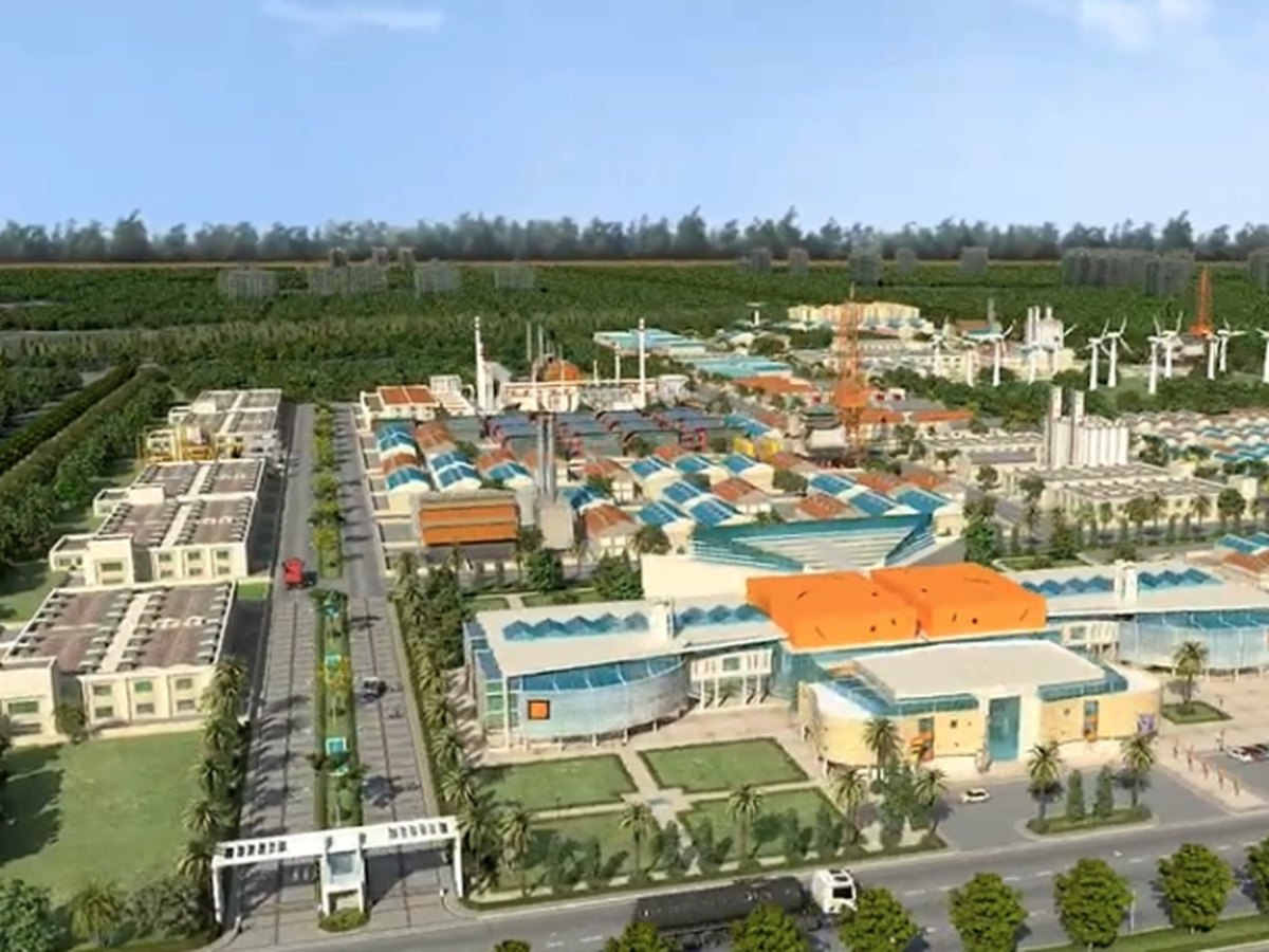 Aerial view of the Golcha Group industrial township at Bhilwara with internal roads, factory sheds and wind turbines