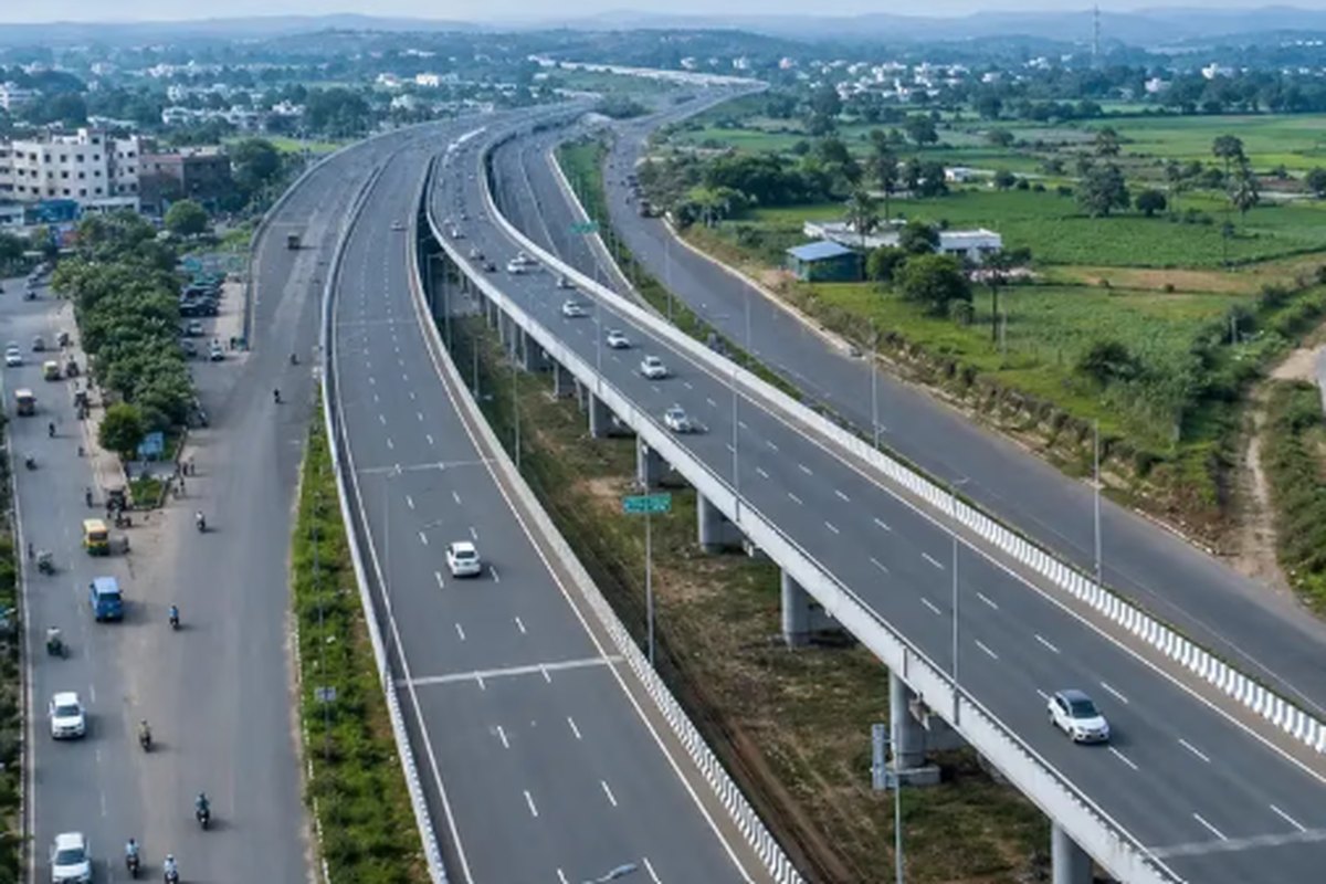 Aerial view of a multi-lane road and elevated flyover through a residential quarter of Kota